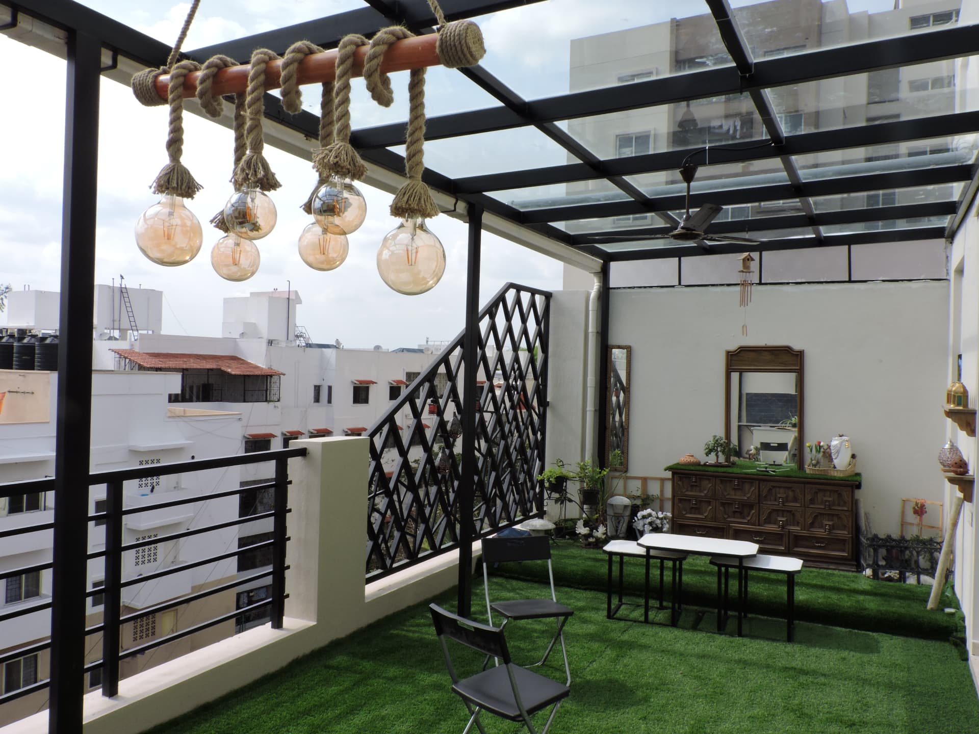 Infinity — terrace garden with rope-hung chandelier
